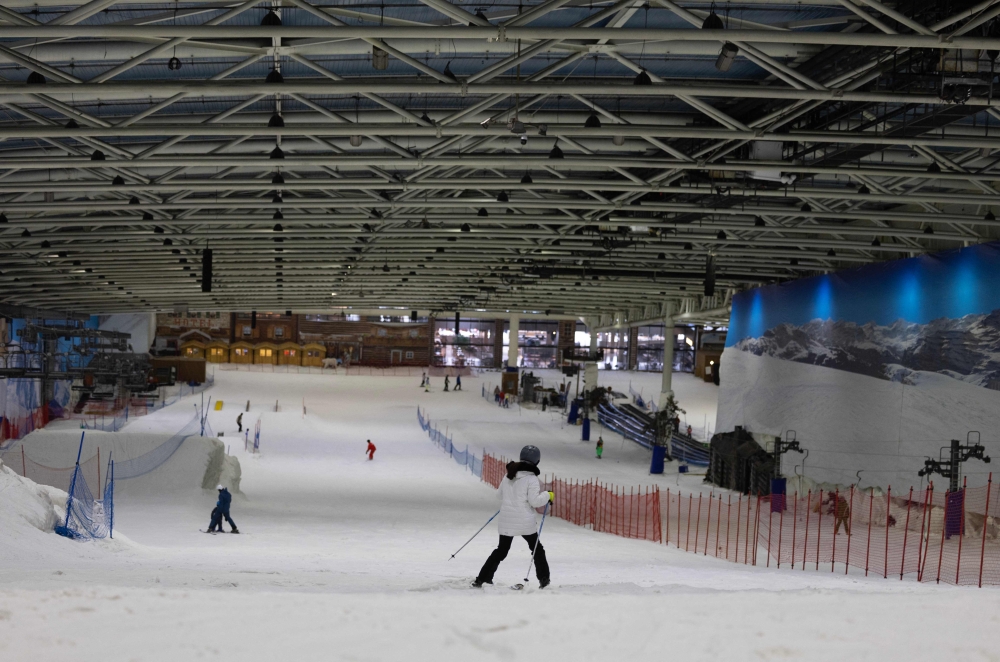 A skier enjoys a run at Xanadu Snozone, the only indoor ski slope in Spain, located in Arroyomolinos, south of Madrid on August 19, 2024. — AFP pic