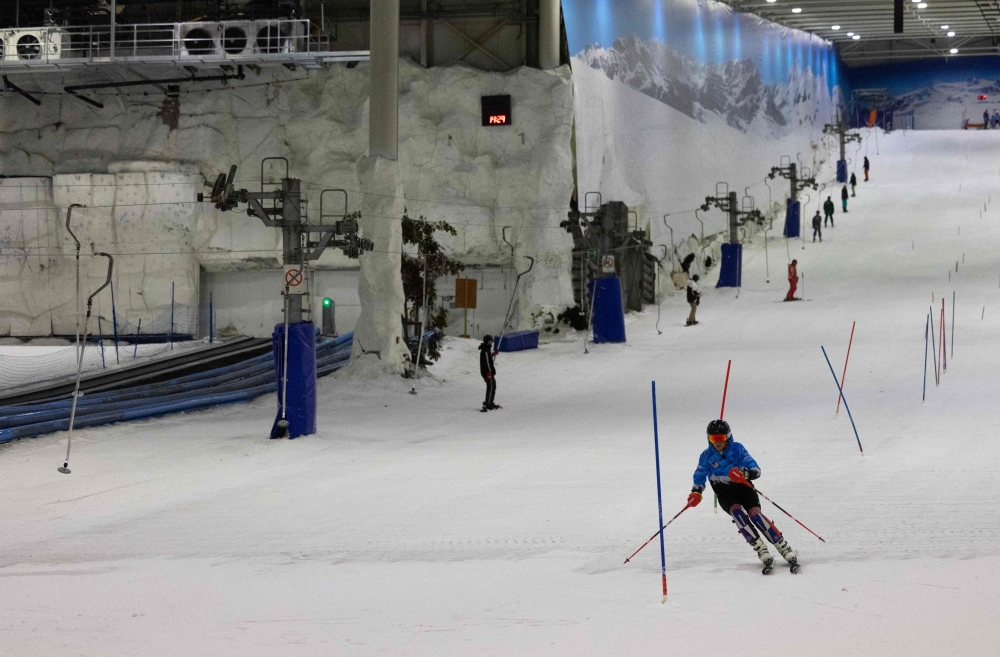 A young member of ‘Ski Club de Carcassonne’, from southern France, trains at Xanadu Snozone, the only indoor ski slope in Spain, located in Arroyomolinos, south of Madrid on August 19, 2024. — AFP pic