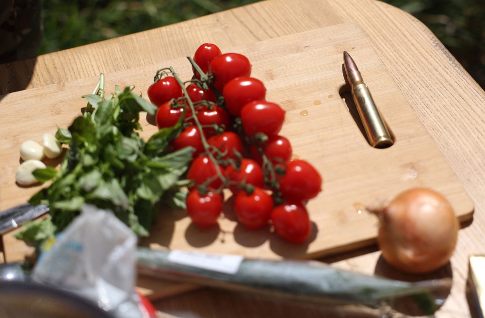 This photograph taken on July 27, 2024, shows ingredients for cooking pasta displayed near a bullet by Ukrainian serviceman and influencer Ruslan Mokrytskyi in an undisclosed location in the Donetsk region— AFP pic