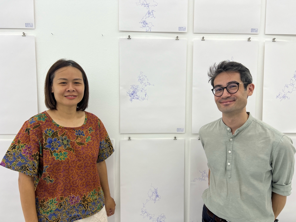 Joel Lim Du Bois (right) and Tan Sueh Li pose with the drawings made with a tychoscope for the ‘What it is of’ exhibition. — Picture by Opalyn Mok