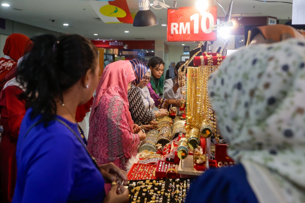 Delegates shop at various booths during the 2024 Umno General Assembly at the World Trade Centre Kuala Lumpur. August 23, 2024. — Picture by Raymond Manuel