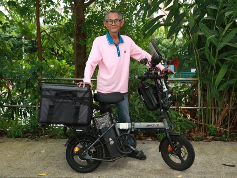 Peter Yeo, a food delivery rider for seven years, says he prefers not to wear his uniform due to discrimination.