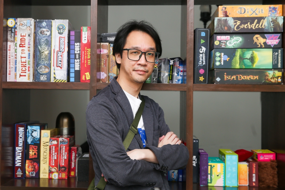 Gray Ham, 36, the curator of Kakitabletop, who has played tabletop games his whole life believes the hobby offers a form of escapism for many. — Picture by Choo Choy May