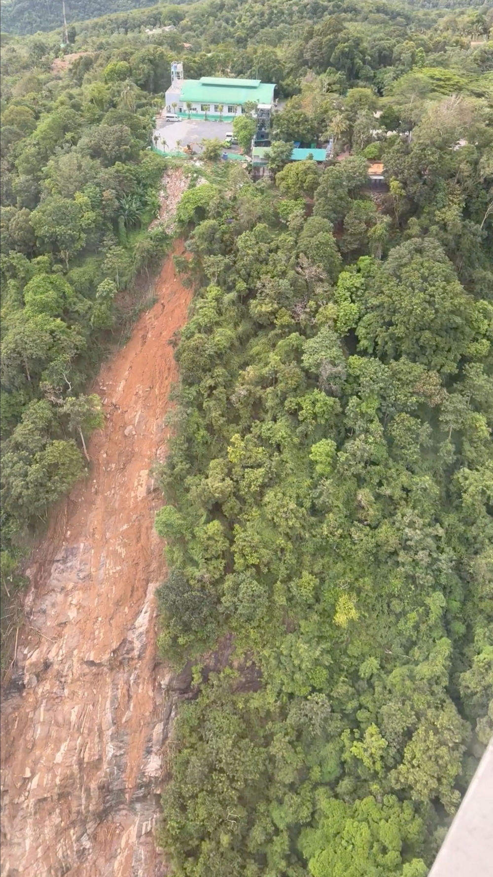 An aerial view shows the area of a landslide in Phuket following heavy rains. This screen grab was obtained from social media video from Flying Phuket (Buffalo Airfield). — Reuters pic