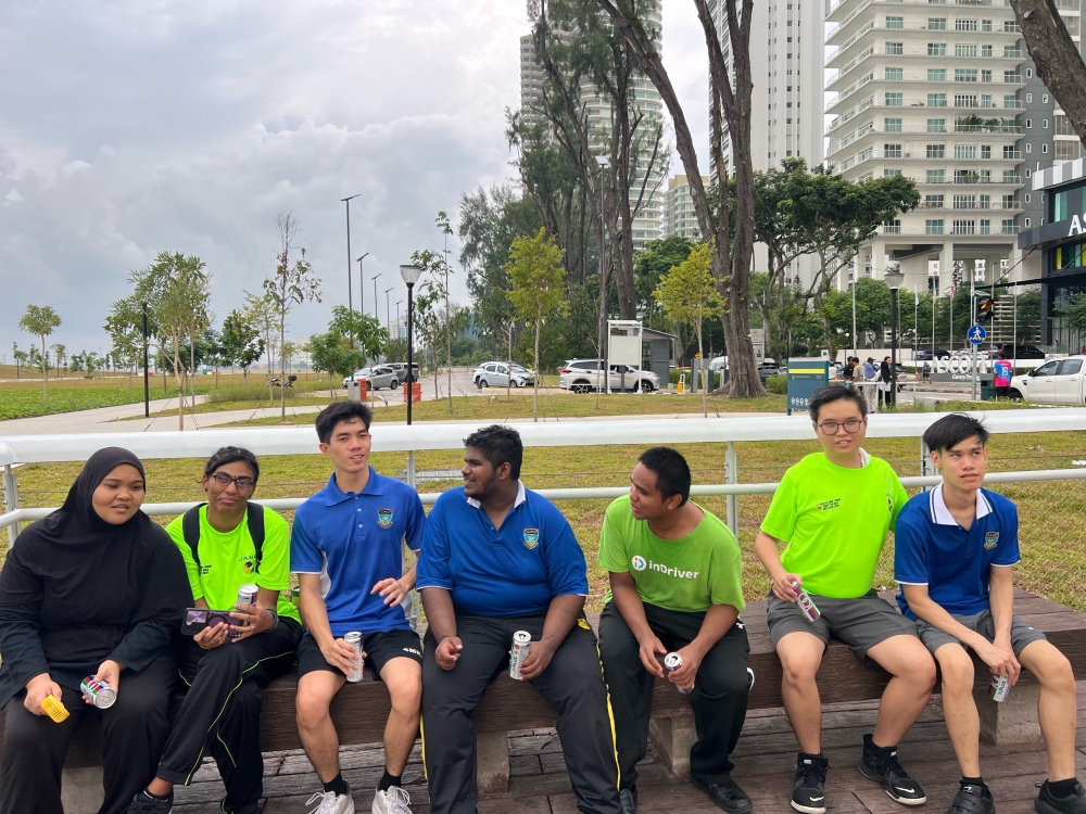 The VIPs resting after running a few loops around Gurney Bay. — Picture by Opalyn Mok