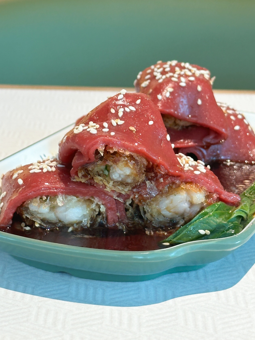 Crispy Prawn Cheong Fun has red coloured rice rolls wrapped around crunchy prawns to give you a contrast of textures — Picture by Lee Khang Yi