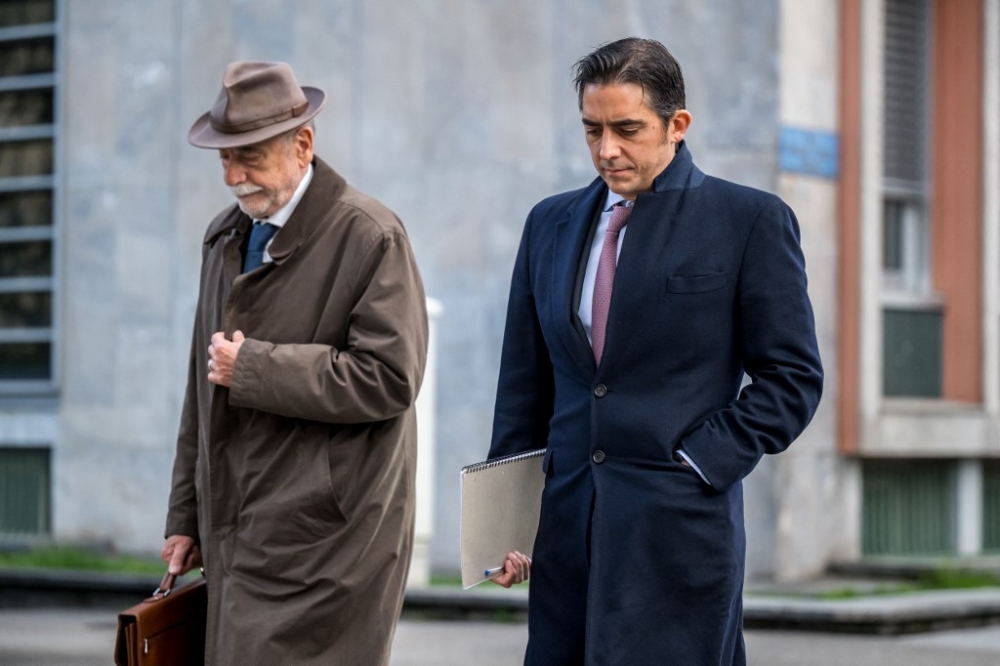 PetroSaudi executive Patrick Mahony (right) arrives with his laywer Maurice Harari at the Swiss Federal Criminal Court for the opening day of his trial for the alleged embezzlement and laundering of the Malaysian sovereign wealth fund 1MDB, in Bellinzona, on April 2, 2024. — AFP pic