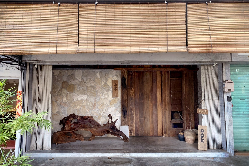 The understated entrance to the café, with bamboo blinds and green bamboo plants. — Picture by CK Lim