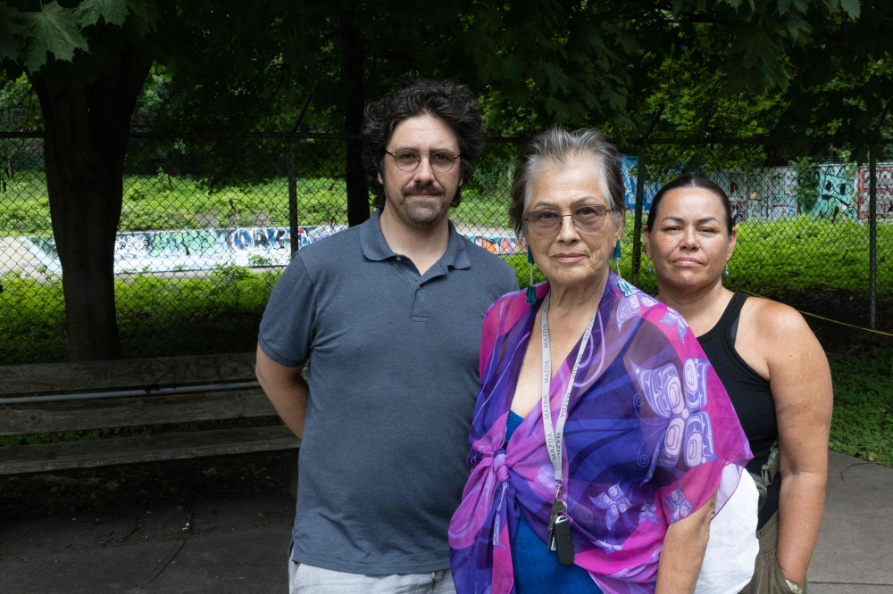 (From left) Anthropologist Philippe Blouin, Mohawk Mothers Kahentinetha and Kwetiio pose in front of the Henry William Morgan Pool at Allen Memorial Institute on July 17, 2024, in Montreal. — AFP pic