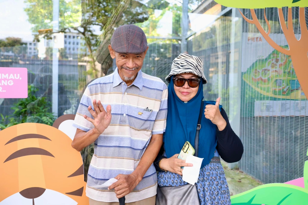 The zoo is a place for all, regardless of their age. A couple pose beside the tiger enclosure at Zoo Johor on August 31, 2024. — Picture from Facebook/Zoo Johor