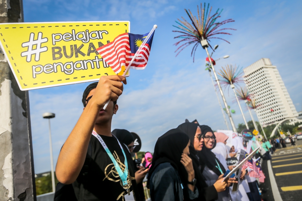 A file photograph showing demonstrators calling for the end of child marriages outside Parliament House in Kuala Lumpur on November 13, 2018. — Picture by Hari Anggara