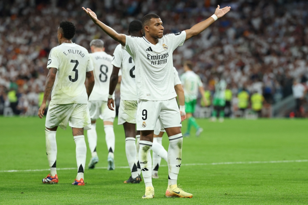 Kylian Mbappe celebrates scoring his team's second goal during the Spanish league football match between Real Real Madrid CF and Real Betis at the Santiago Bernabeu stadium in Madrid on September 1, 2024. — AFP pic