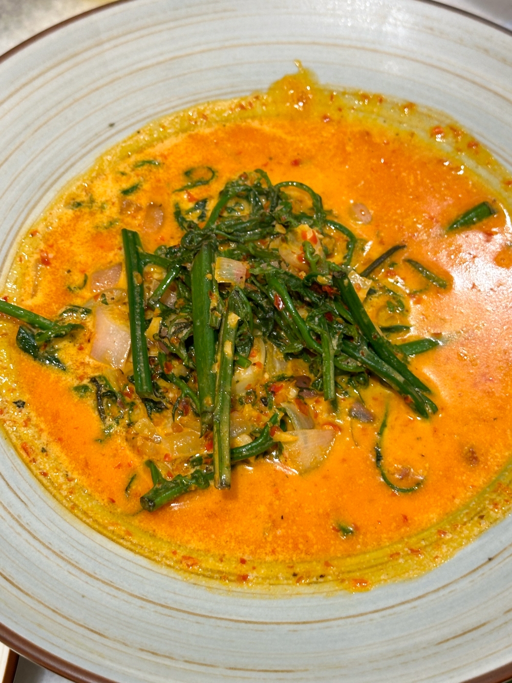 Flood your rice with the Gulai Paku, where fern fronds are paired with creamy, mildly spicy curry — Picture by Lee Khang Yi