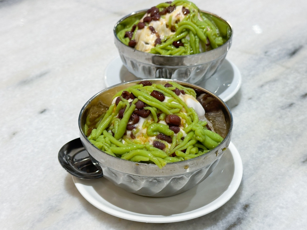 End your meal with a bowl of Cendol with pale green jelly, red beans on a bed of shaved ice flavoured with ‘gula Melaka’ and thick coconut cream — Picture by Lee Khang Yi