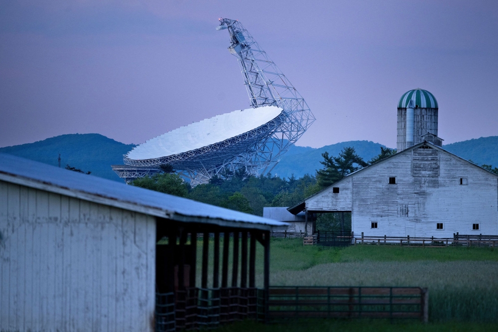 The Green Bank Telescope, a 100-meter fully steerable radio telescope, is seen near a farm in the Green Bank Observatory in the US National Radio Quiet Zone. — AFP