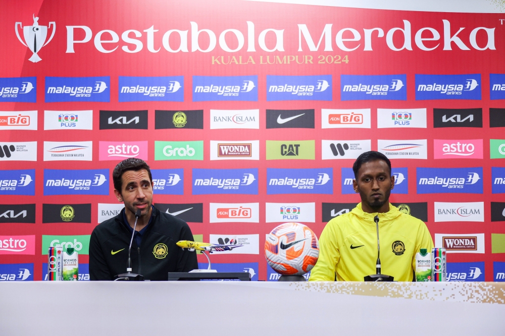 Harimau Malaya head coach Pau Marti Vicente with his midfielder Syamer Kutty Abba, speak to the press ahead of the match against the Philippines. — Bernama pic