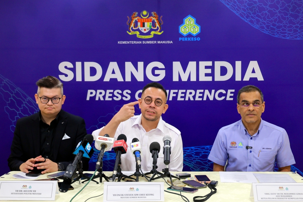 Human Resources Minister Steven Sim speaks at a special press conference of the Social Security Organisation (Socso) at Menara Sokeso, Jalan Ampang September 4, 2024. Also present is the Socso CEO Datuk Seri Mohammed Azman Aziz Mohammed (right). — Bernama pic