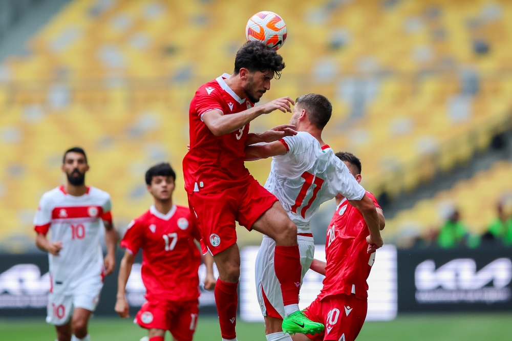 Tajikistan player Rahmatsho Rahmatzoda being challenged by Lebanon player Majed Osman during the semifinal match of the 2024 Merdeka Tournament between Lebanon and Tajikistan at Bukit Jalil National Stadium, September 4, 2024. — Bernama pic 