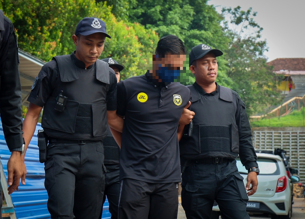 Lance Corporal Muhammad Alif Monjani, 26, is accused of killing Nur Farah Kartini, a former student of Universiti Pendidikan Sultan Idris (UPSI), at the palm oil plantation in Kampung Sri Keledang, Hulu Bernam, between July 10 and July 15. — Bernama pic