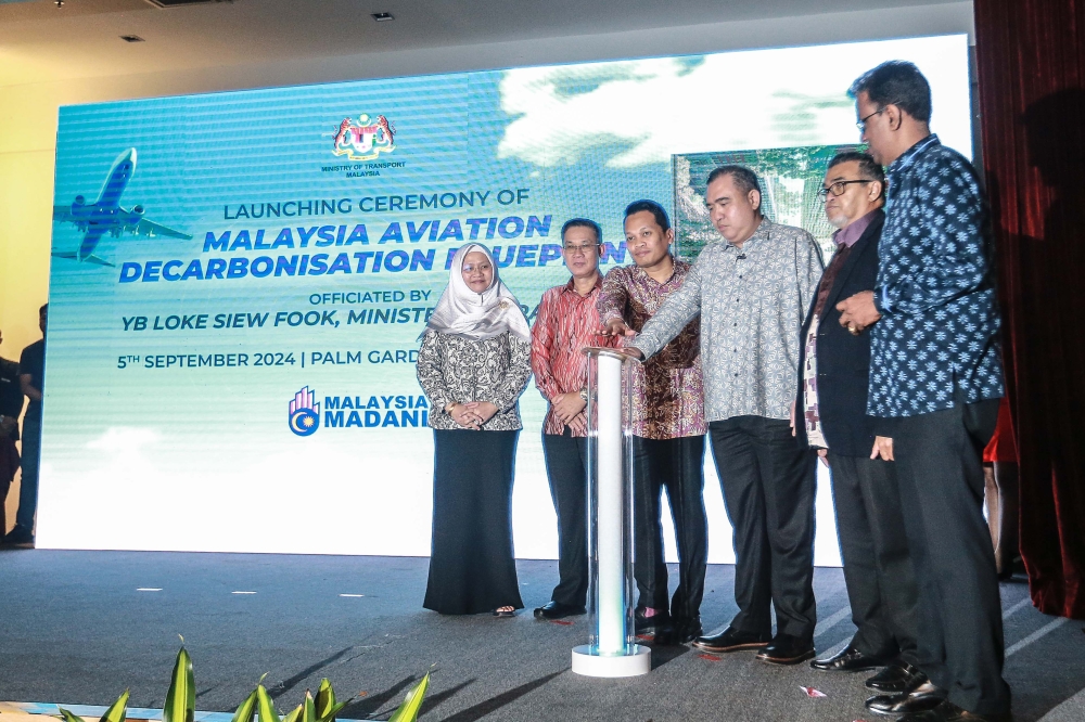 Transport Minister Anthony Loke Siew Fook (3rd right) and Natural Resources, Environment and Climate Change Minister Nik Nazmi Nik Ahmad (3rd left) with other VIPs officiate the launch of the Malaysian Aviation Decarbonisation Blueprint in Putrajaya September 5, 2024. — Picture by Sayuti Zainudin