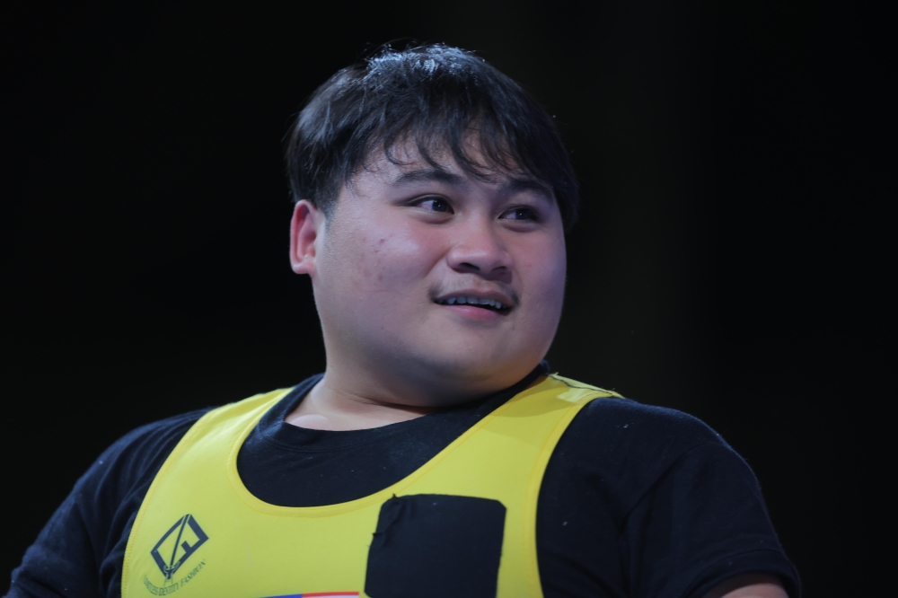 National powerlifter Bonnie Bunyau Gustin is eyeing his second Paralympian gold at the Paris games tomorrow. — Bernama pic