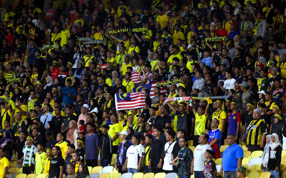 People attend the Merdeka Tournament semi-final match between Malaysia and the Philippines at Bukit Jalil National Stadium in Kuala Lumpur September 4, 2024. — Bernama pic