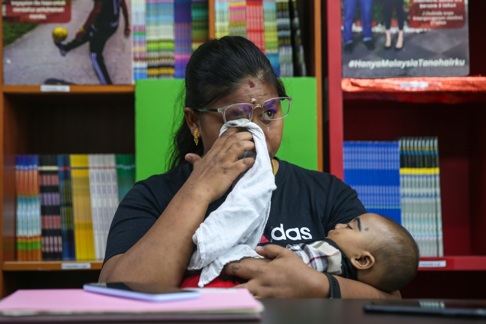 As a stateless person, Kathrina is unable to get jobs and support her husband financially to raise her two children. — Picture by Yusof Mat Isa 