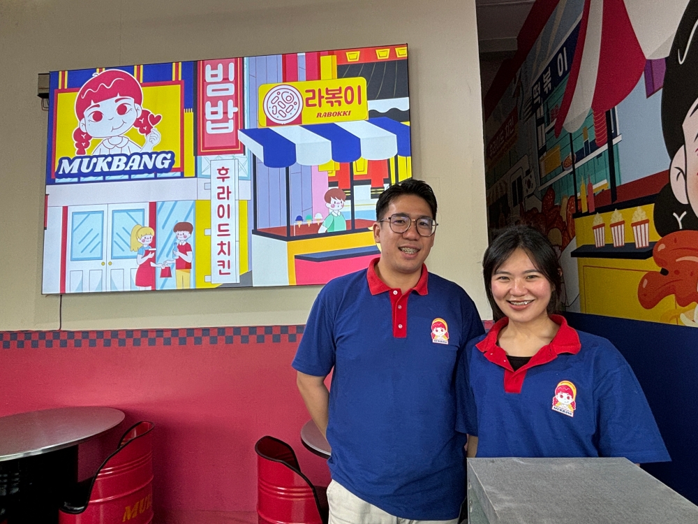 Ricky and Mijii Yong started Mukbang, a fast-food style Korean street food outlet during the lockdown in their family’s coffee shop and has grown into three outlets. — Picture by Julia Chan 