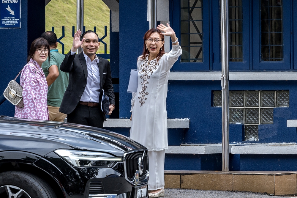 Seputeh MP Teresa Kok arrives, with her lawyer Syahredzan Johan, to give her statement at Bukit Aman police headquarters in Kuala Lumpur September 10, 2024. — Picture by Firdaus Latif