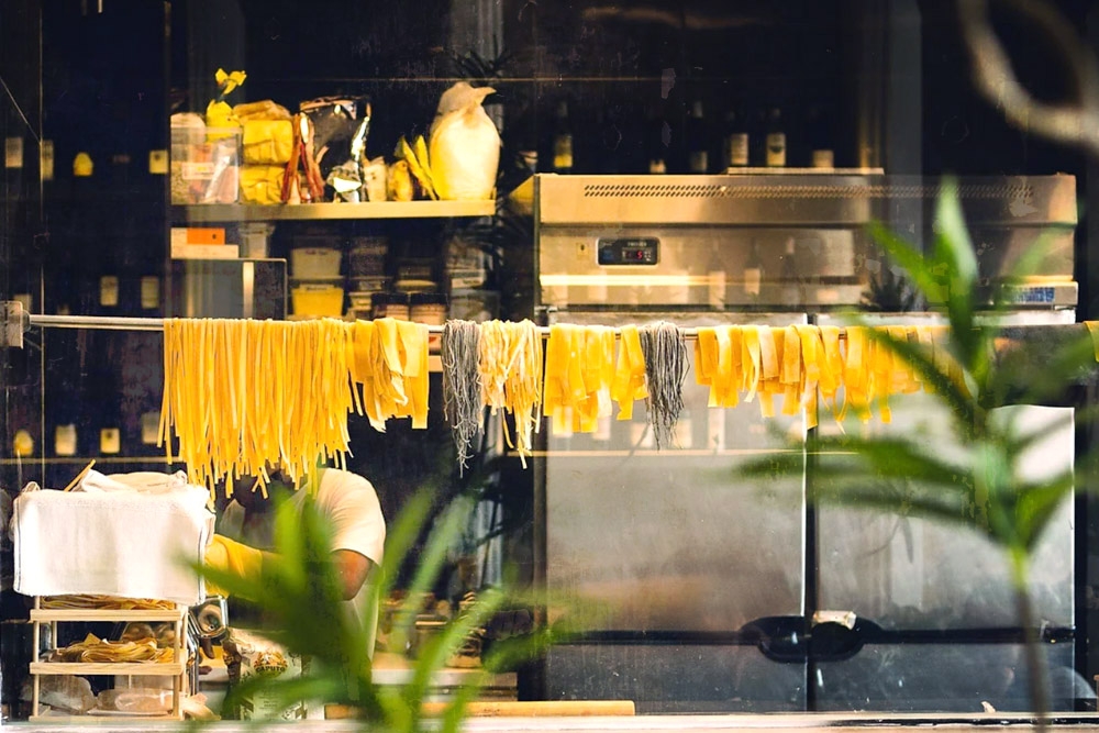 Hanging freshly made pasta to dry. — Picture courtesy of Staple Dough