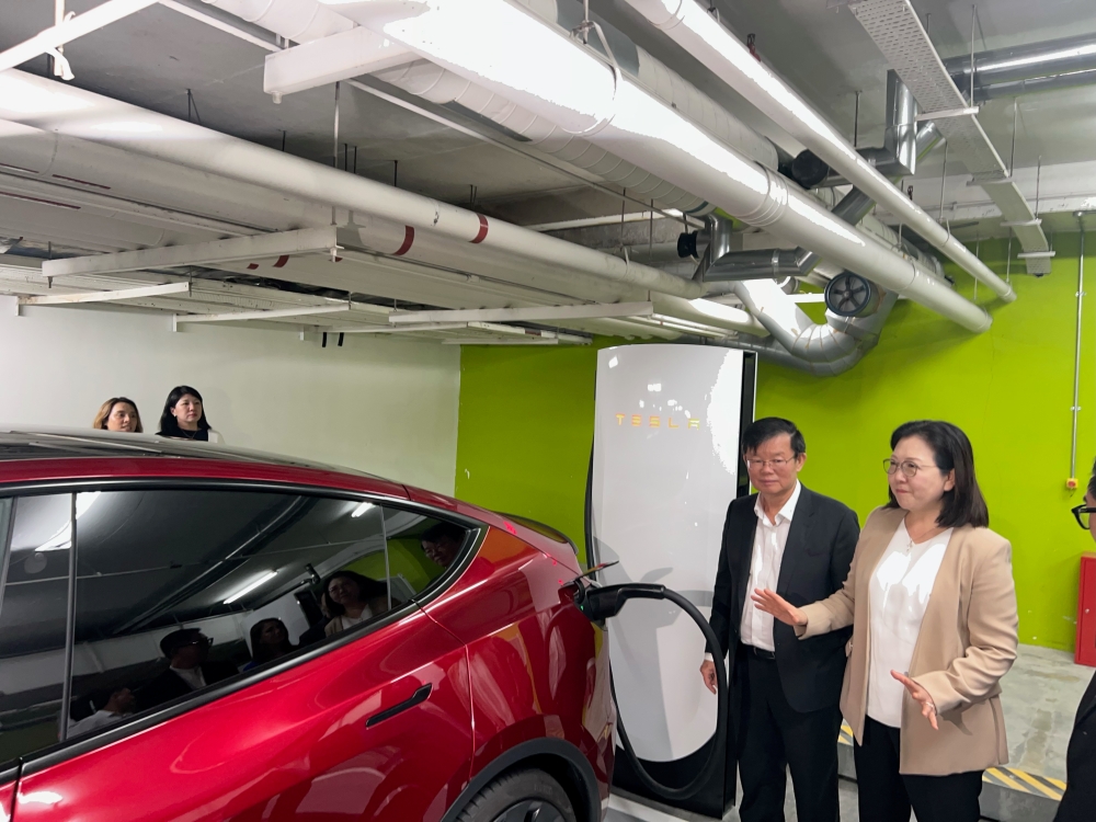 Penang Chief Minister Chow Kon Yeow and Tesla’s regional director Isabel Fan at the launch of the V4 supercharger station in Gurney Plaza. — Picture by Opalyn Mok