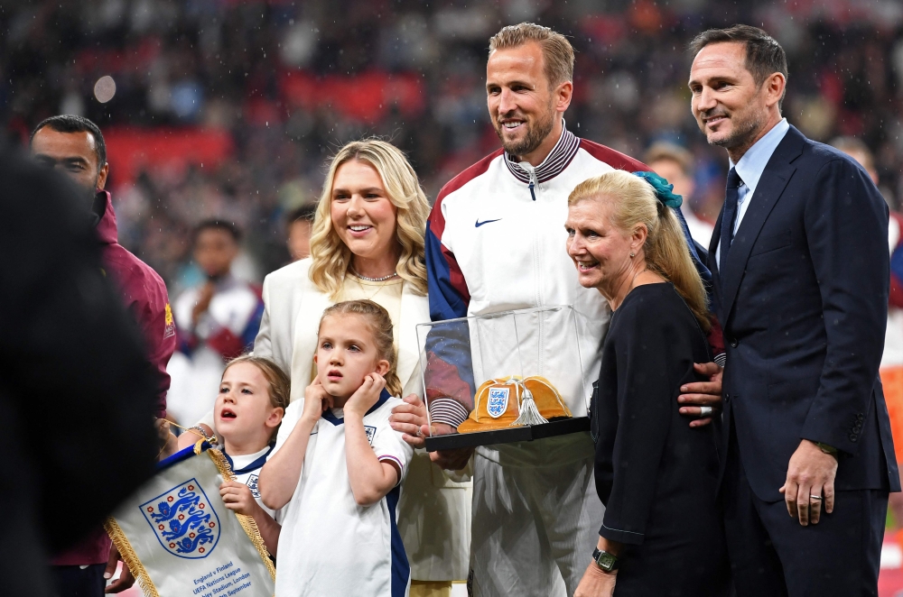 England's striker Harry Kane, with his children and fellow centurions Ashley Cole (left) and Frank Lampard, react after receiving his 100th Cap ahead of the Nations League match between England and Finland at Wembley Stadium in London on September 10, 2024. — AFP pic