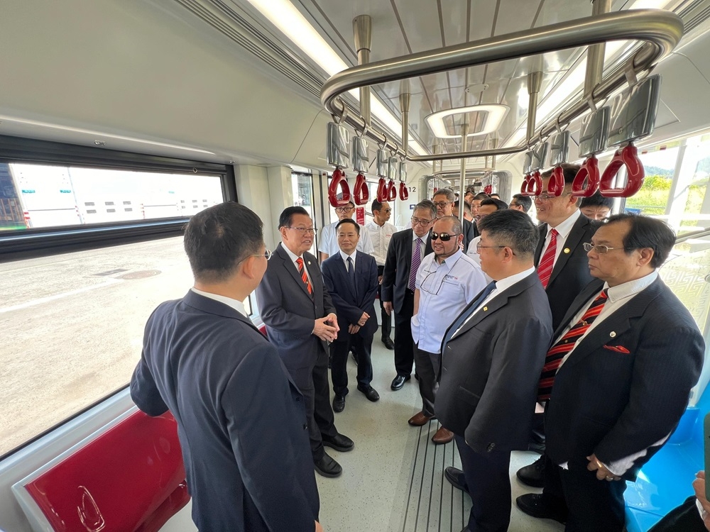 Sarawak Transport Minister Datuk Seri Lee Kim Shin (2nd left) and the Sarawak delegation get a feel of the first ART vehicle which will be delivered soon. — The Borneo Post pic 