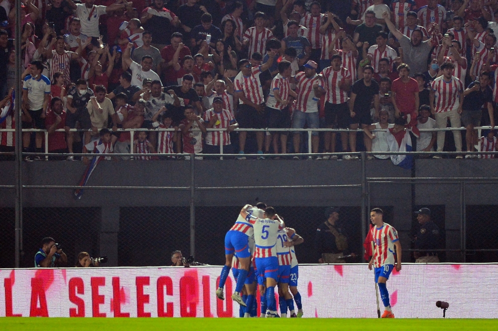 Paraguay's players celebrate after scoring during the 2026 FIFA World Cup South American qualifiers football match between Paraguay and Brazil at the Defensores del Chaco stadium in Asuncion, on September 10, 2024. — AFP pic