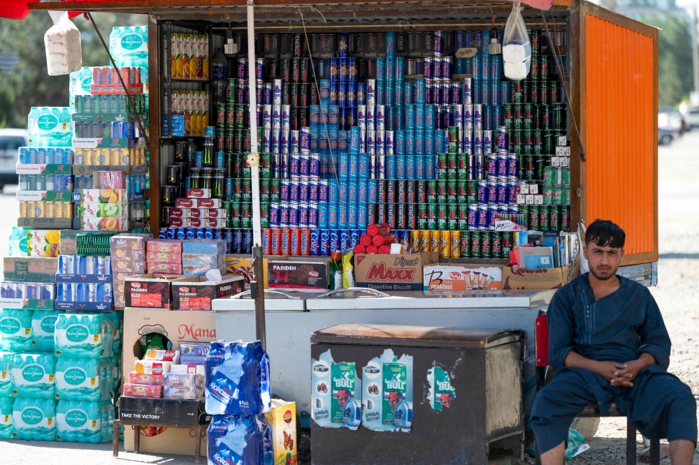 Energy drinks, which are high in caffeine and sugar and often more available than drinking water at roadside kiosks. — AFP pic