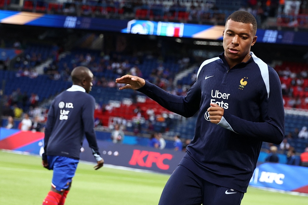 France's forward Kylian Mbappe warms up prior to the Uega Nations League football matchwith Italy at the Parc des Princes in Paris on September 6, 2024. — AFP pic