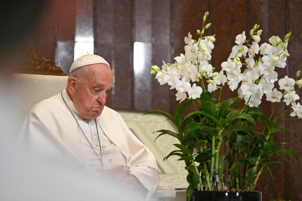 Pope Francis meets with Singapore President Tharman Shanmugaratnam (not pictured) at the Parliament House in Singapore, on September 12, 2024. — AFP pic