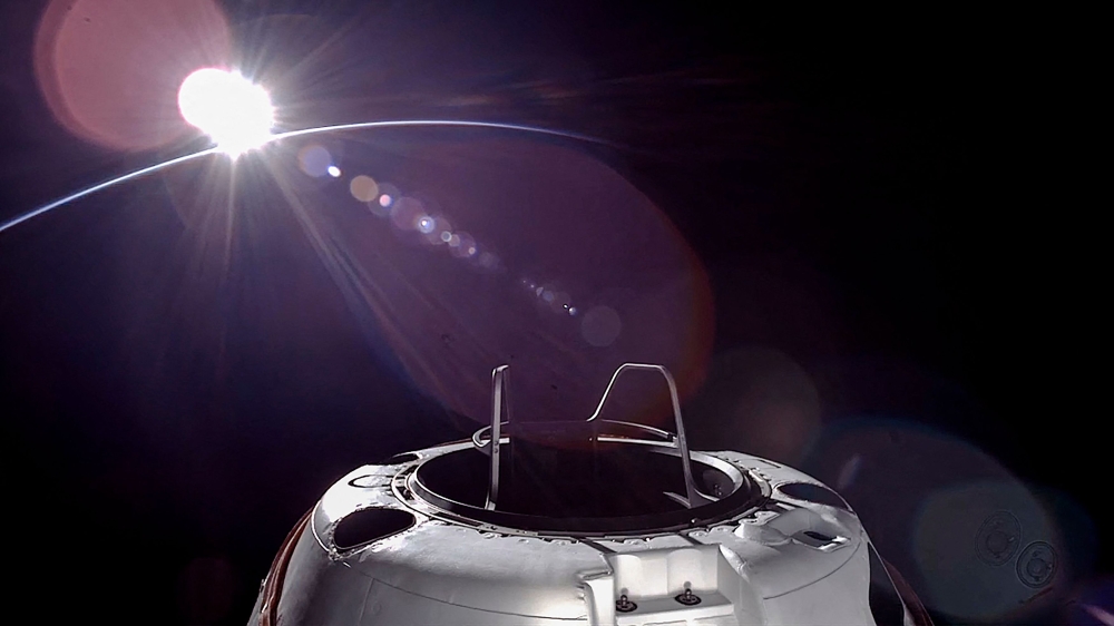 This handout picture courtesy of SpaceX and Polaris taken on September 12, 2024, shows an orbital sunset from the SpaceX Dragon capsule with a hatch structure called ‘Skywalker’, ahead of the first private spacewalk performed by the crew of the SpaceX Polaris Dawn mission. —  Polaris Program handout pic via AFP