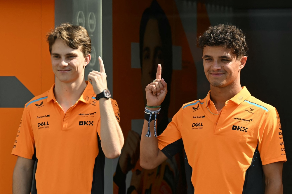 McLaren's Australian driver Oscar Piastri (left) and McLaren's British driver Lando Norris pose ahead of the Formula One Azerbaijan Grand Prix in Baku on September 12, 2024. — AFP pic