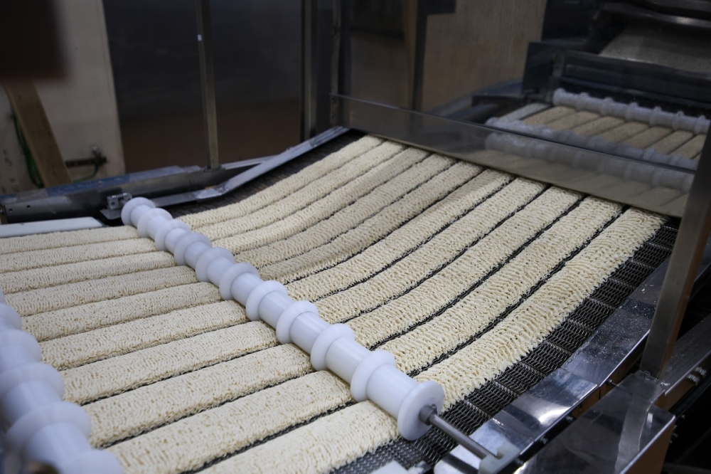 The noodles are shaped into wavy patterns using specific rollers in the production machine. — Picture courtesy of Maggi