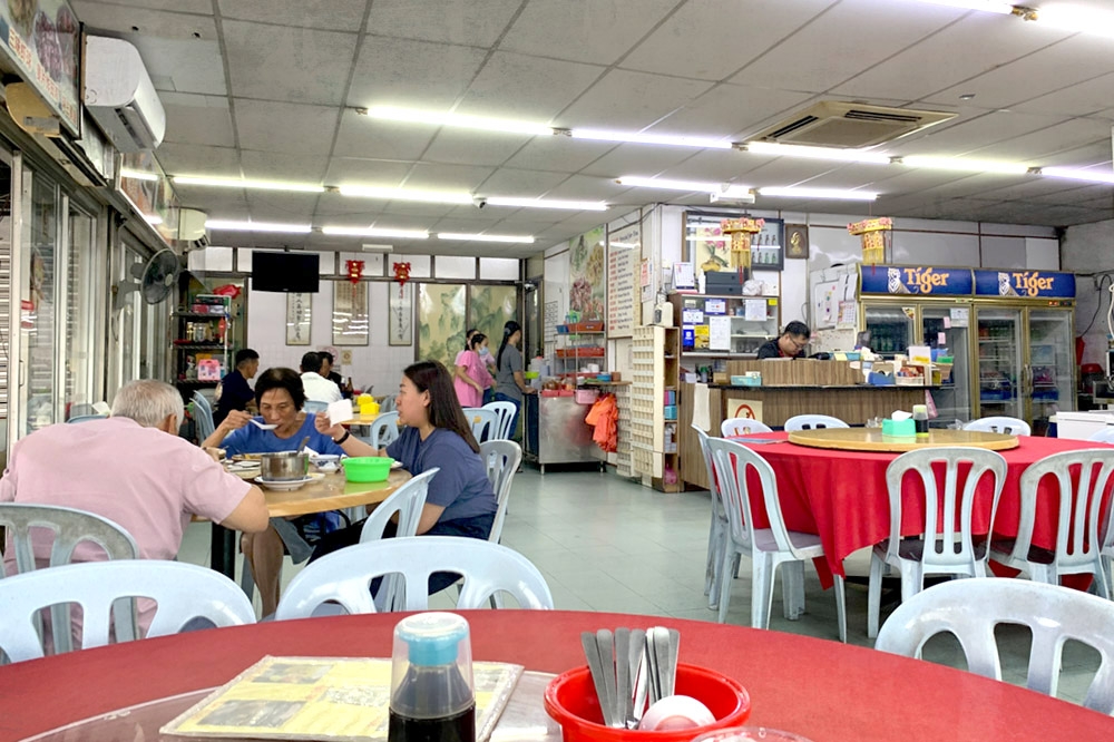 Old school interior with red tablecloths, paper lanterns and faded Chinese calligraphy. — Picture by CK Lim