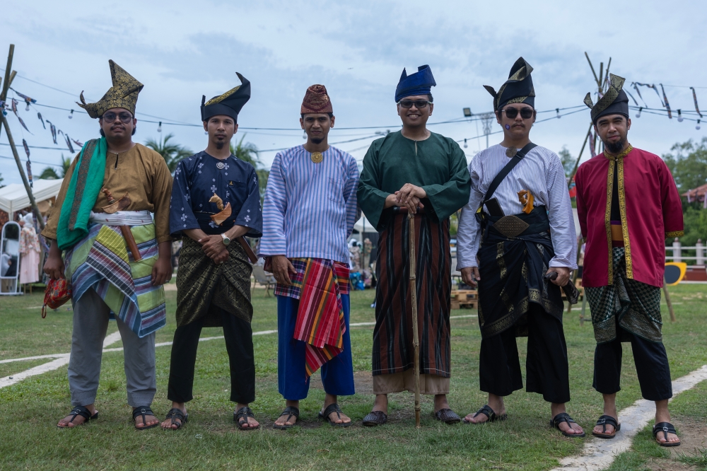 Participants of the Kelantan Keretapi Sarong 2024 programme, dressed in traditional attire, during the gathering at Padang Kemahkotaan Tumpat (Pata Ndo) in Kota Baru, September 14, 2024. — Bernama pic 