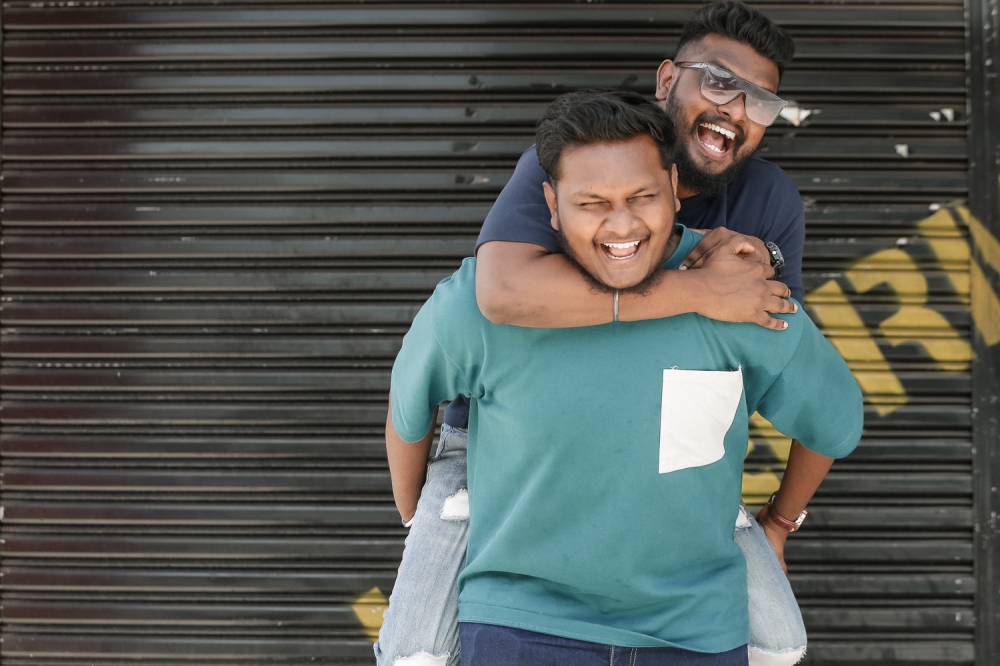 Comedians Devaraj and Devadass share a light-hearted moment during an interview session at Juasseh, Negeri Sembilan. — Picture By Raymond Manuel