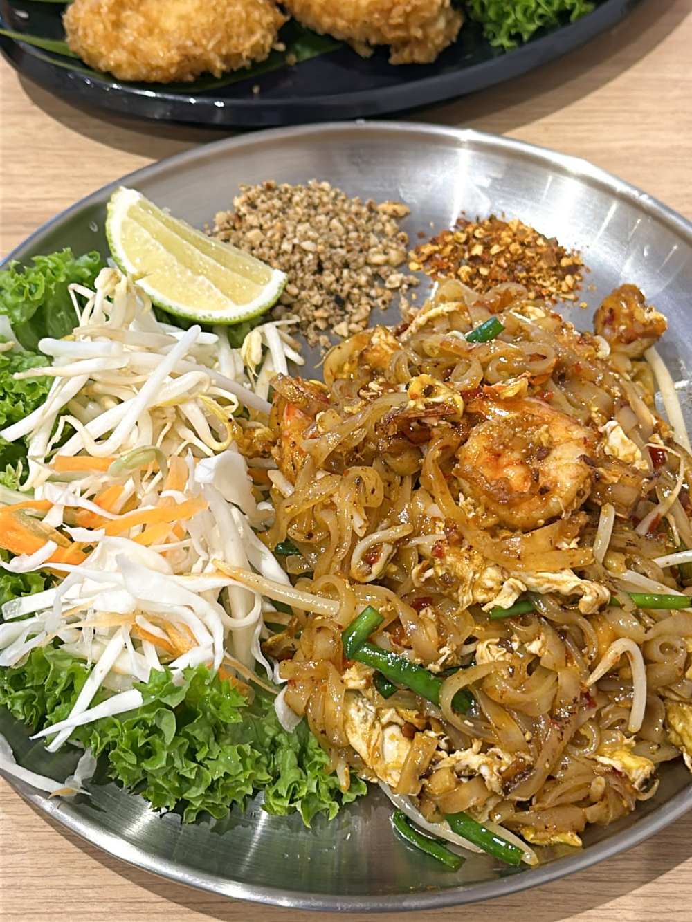 Pad Thai has the chewy texture but flavours seem muted here.