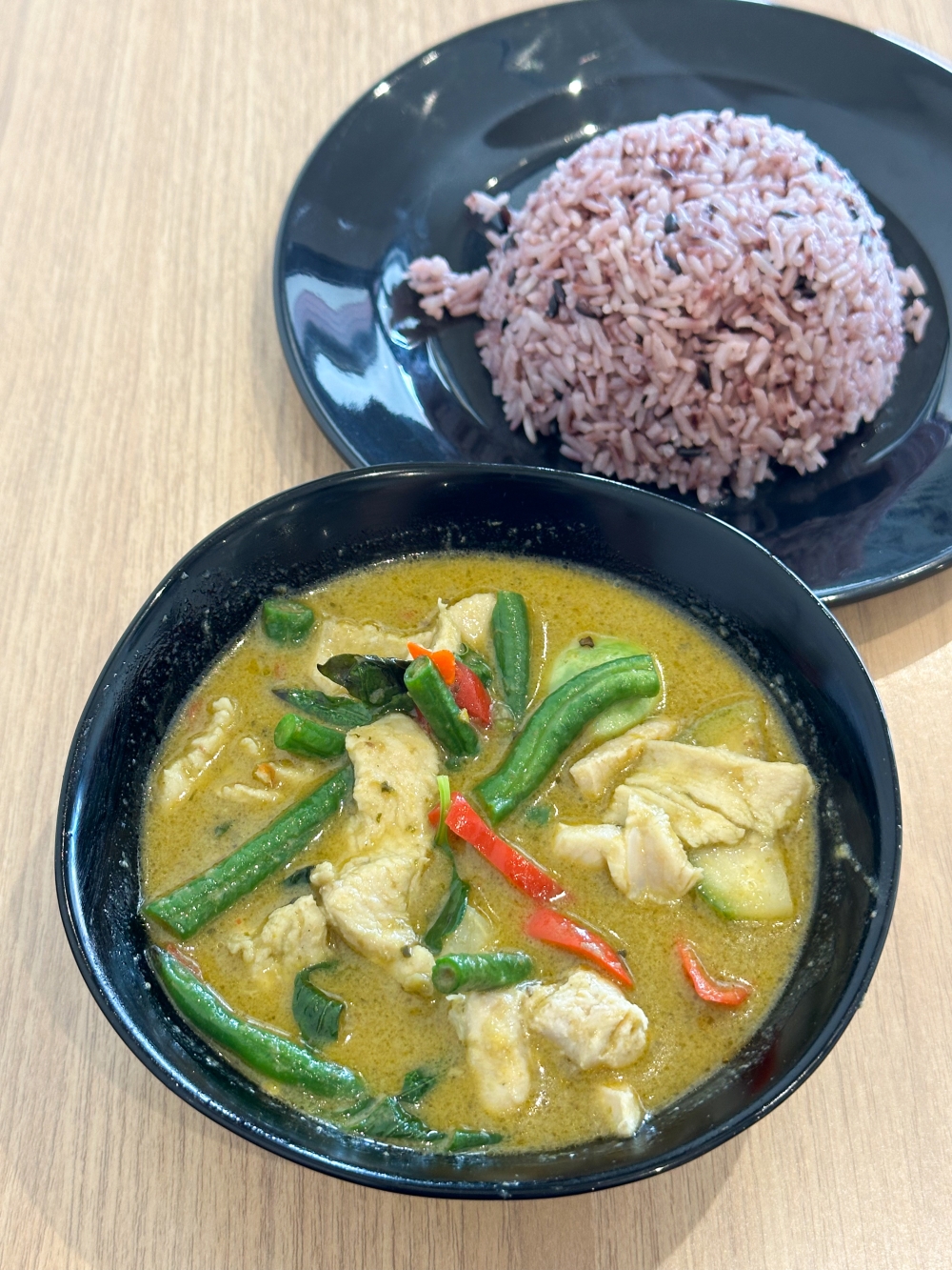 Green Curry Chicken with Rice pairs a gentler curry with chicken breast.