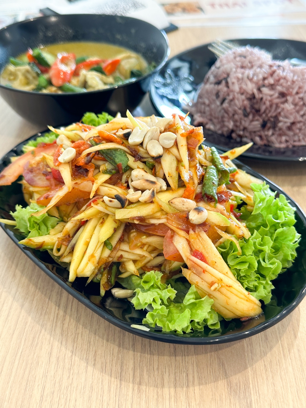 Hit up the Papaya Salad with Fermented Fish for a rocking good time in your mouth with its spicy, tangy flavours. 