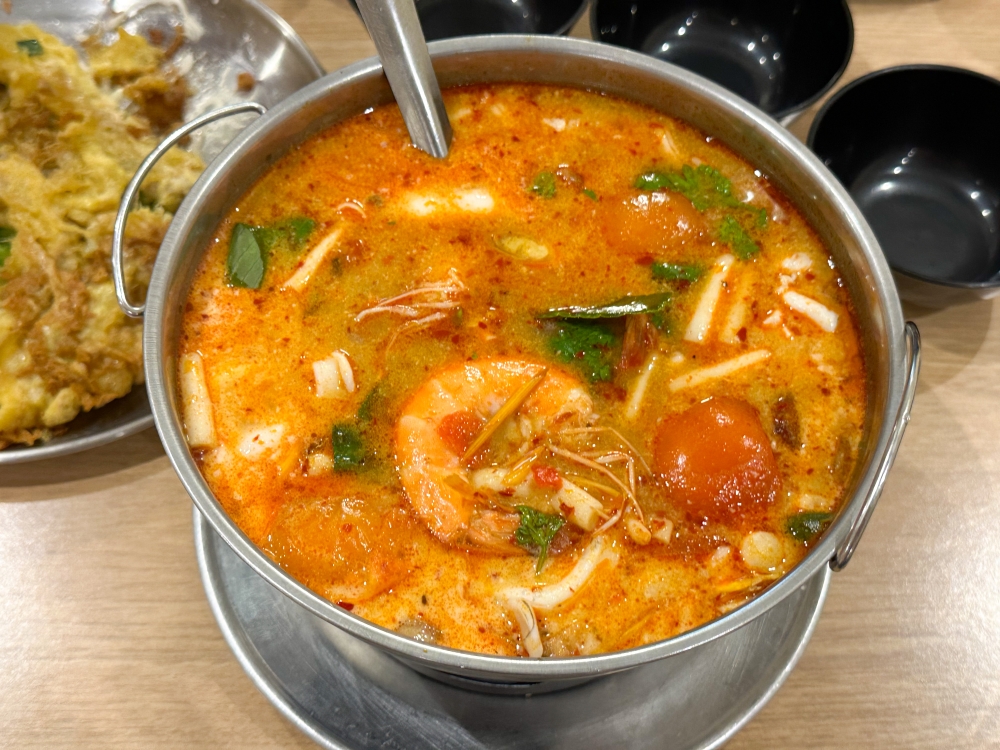 Piquant Red Creamy Tom Yum Seafood Soup is well balanced without the burning tongue.