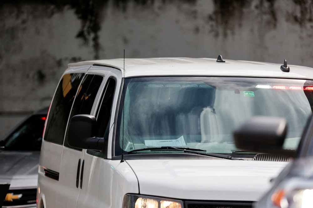 A vehicle, believed to be carrying Ryan W. Routh, the reported suspect in an apparent assassination attempt on Republican presidential nominee and former US President Donald Trump, is seen, outside the Paul G Rogers Federal Building US Courthouse in West Palm Beach, Florida September 16, 2024. — Reuters pic  