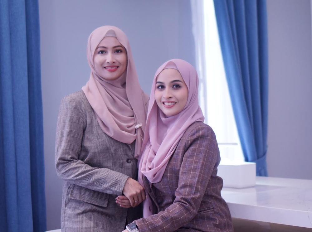 Siti Suhana Kamal Admi (left) and Siti Suraya Kamal Admi, founders of Suraya Mothercare and Beauty in Johor Baru, Johor. — Picture by Suraya Mothercare and Beauty