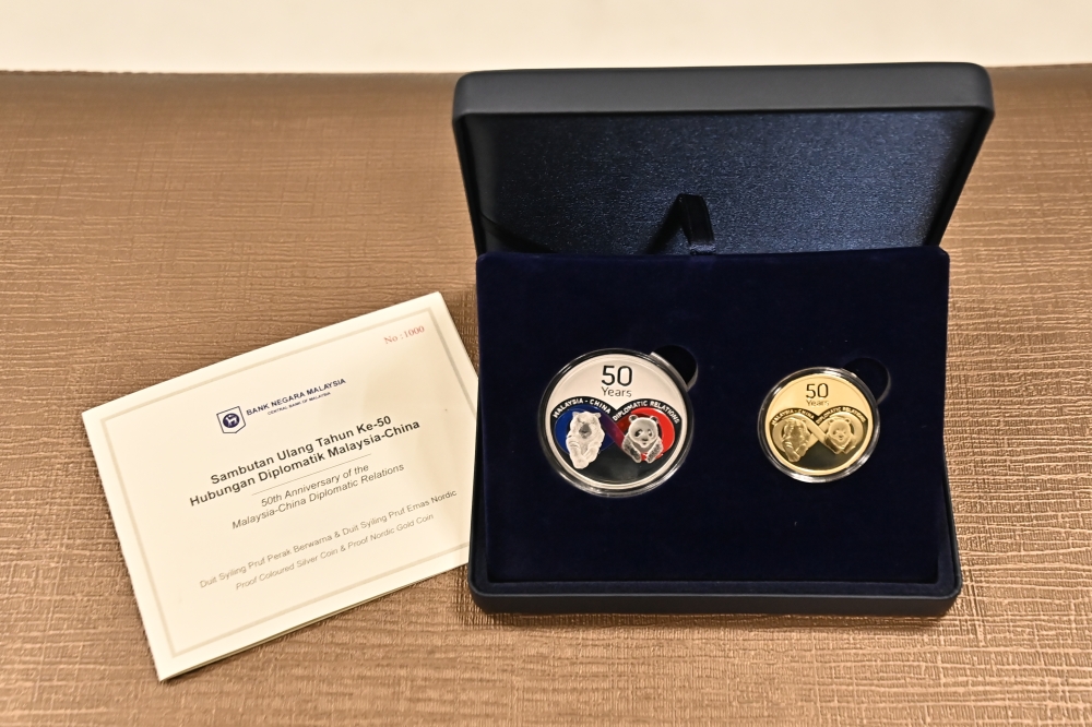 The commemorative coins issued to mark the 50th anniversary of diplomatic ties between Malaysia and the People’s Republic of China. — Picture courtesy of Ministry of Foreign Affairs